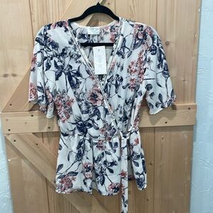 Sienna sky crossover side tie blouse. Size Lg. NWT